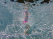 underwater photography of child swimming